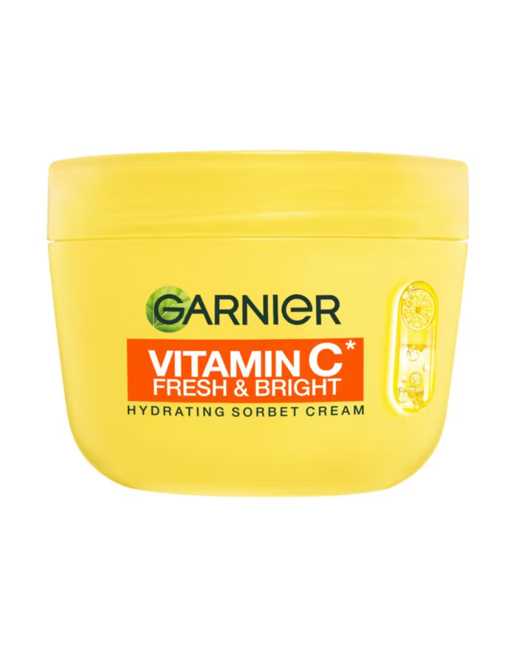 Yellow jar of Garnier Vitamin C Fresh & Bright Hydrating Sorbet Cream. Lemon illustration on the side; clean, fresh look.