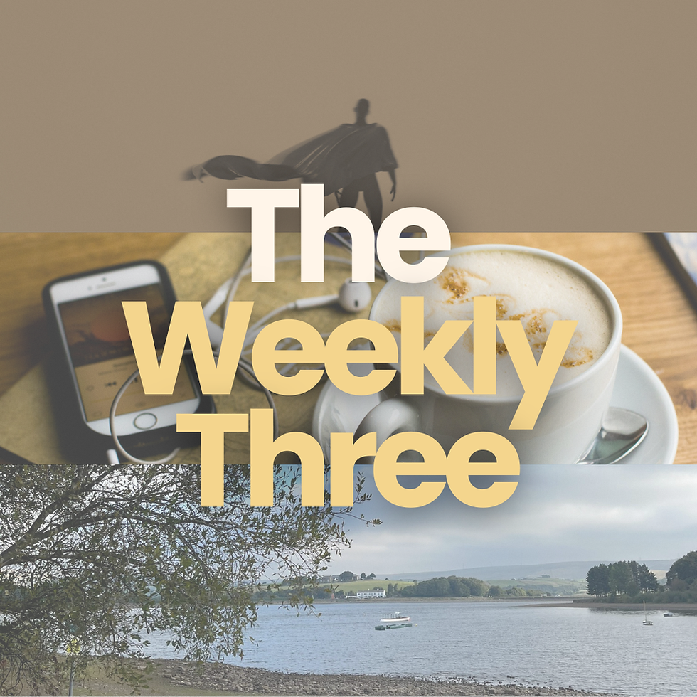 Coffee, phone, and earbuds on a table with "The Weekly Three" text overlay. Background features a silhouette of a man and a serene lake scene.
