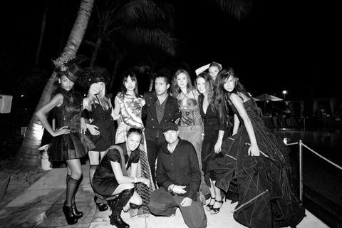 Artist and photographer Sean Murdock and friends standing in Miami in the dark