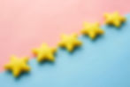 blue and pink background with 5 yellow stars demonstrating 5-star reviews