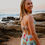 Thumbnail: back view  of girl in mint african florals  printed one-piece swimming costume
