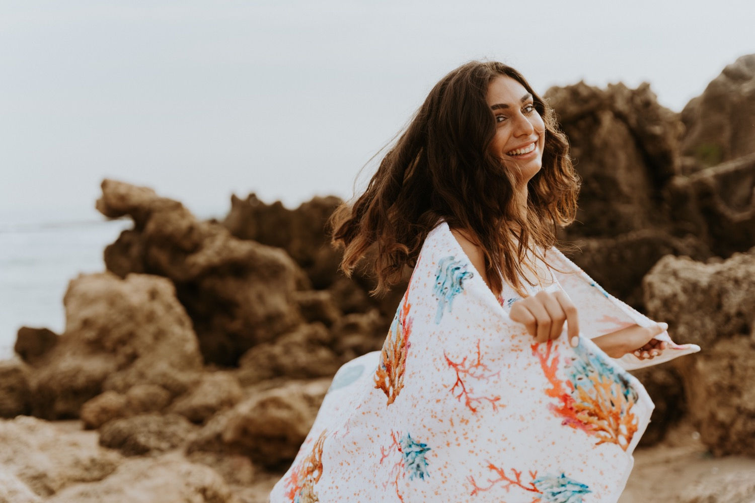 white coral colelction printed cotton towel on girl at the beach
