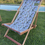 Thumbnail: tropical african jungle printed deck chair skin with beachwood frame on grass near pool