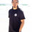 Thumbnail: a man wearing a black cotton t-shirt on the beach