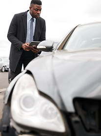 male-insurance-loss-adjuster-with-digita
