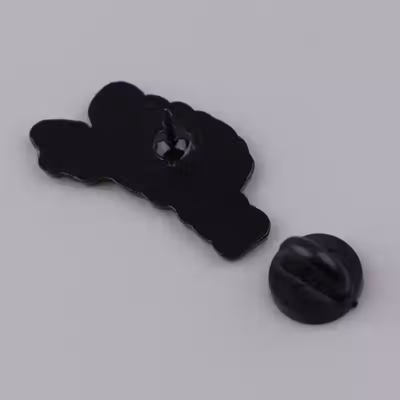 Thumbnail: Back of enamel pin badge saying probably overstimulated