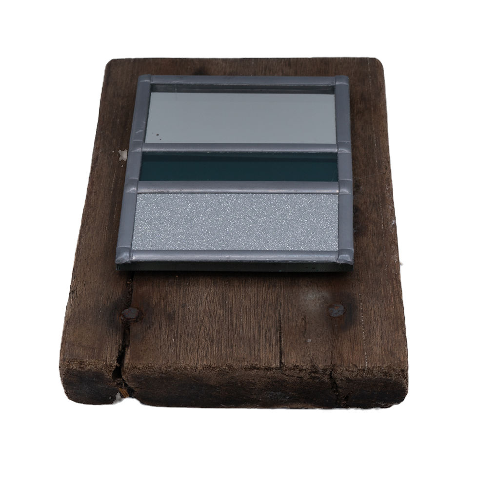 Thumbnail: Small outdoor garden mirror on Hastings pier deck board. Alison Purdy mirror.