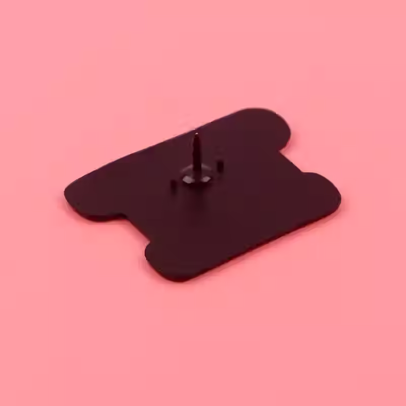 Thumbnail: Back of enamel pin badge saying bombastic side eye, with two eyes looking to the left