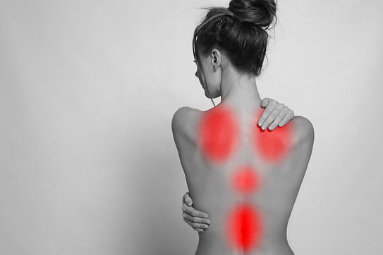 Woman suffering from back pain on light background, space for text.jpg