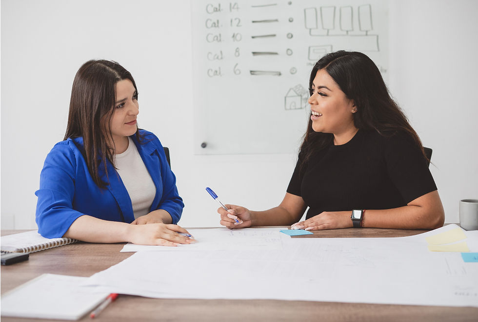Indian female employees are having a discussion at their workplace.