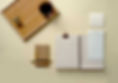 Minimalist desk flat lay with coffee, notebook, calendar, and wooden tray.