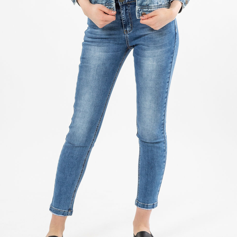 Woman wearing blue denim jeans and a denim jacket