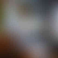 A sign saying "Moosonee Fur Trading Post" with objects from the fur trading era