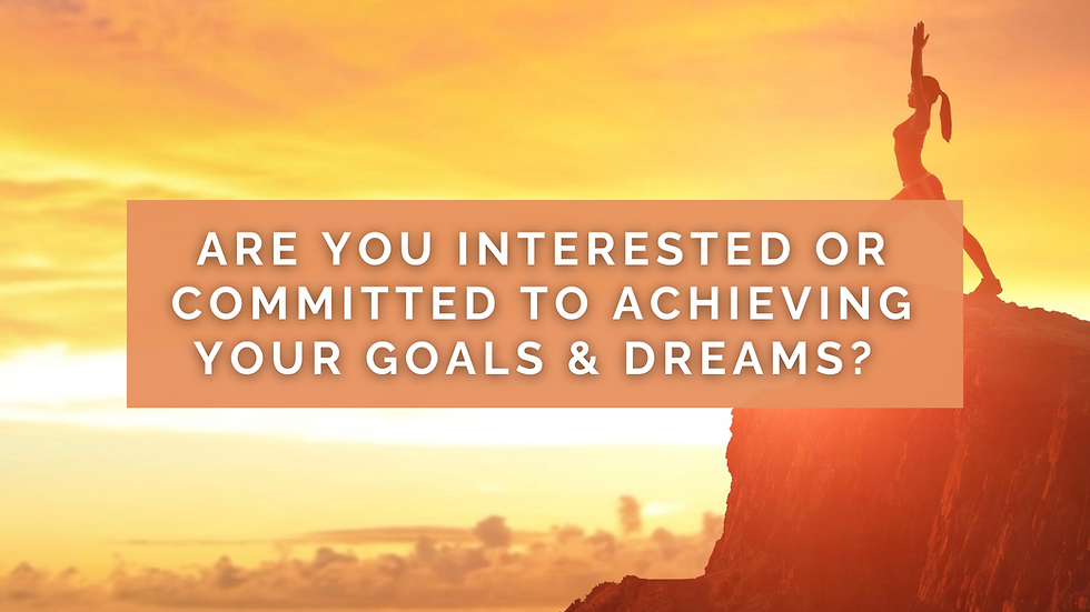 A determined woman raising her hand at sunrise, symbolizing commitment to achieving her dreams.