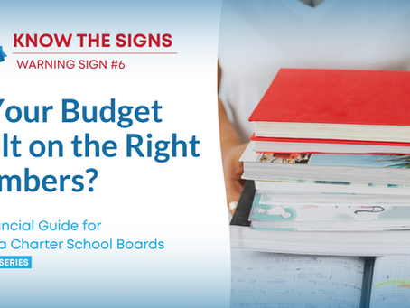 A graphic titled "KNOW THE SIGNS: WARNING SIGN #6" from Charter Sage CPA, featuring the question "Is Your Budget Built on the Right Numbers?" in blue text. The banner includes a subtitle, "A Financial Guide for Florida Charter School Boards," and notes it is part of a "10 PART SERIES." On the right, a person holds a large stack of books and financial documents over open notebooks.