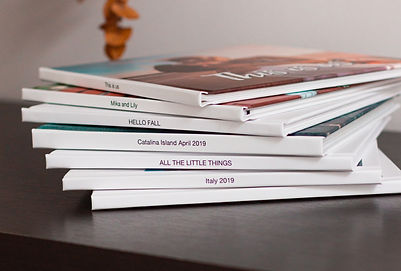 Stack of layflat photo books on a table