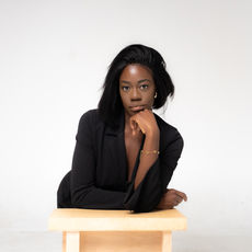 Confident professional woman posing in Chicago self-portrait studio