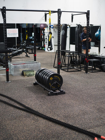Personal Trainer Assisting Strength Training in Williamstown
