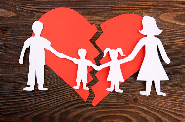 Paper cutout silhouette of a family spli