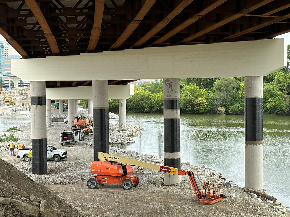 Carbon Fiber FRP Concrete Column bridge wraps supporting an overpass over a river utilizing SRS-600UNI Structural Reinforcement Solutions CFRP to strengthen and reinforce the support columns on a DOT project in Ohio