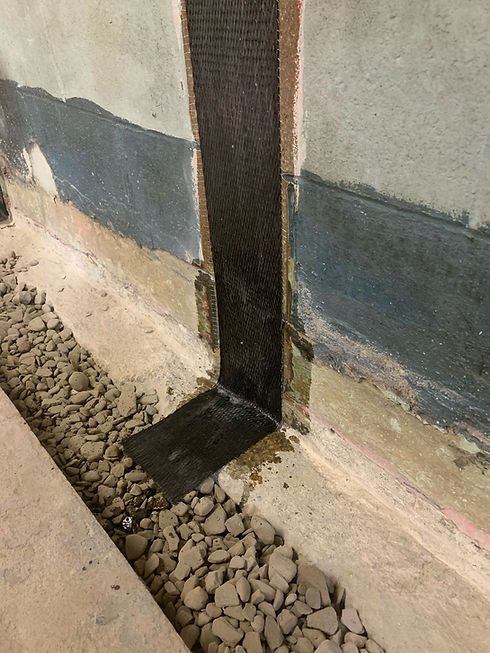 Bowed Wall Repair using CFRP with interior drainage system