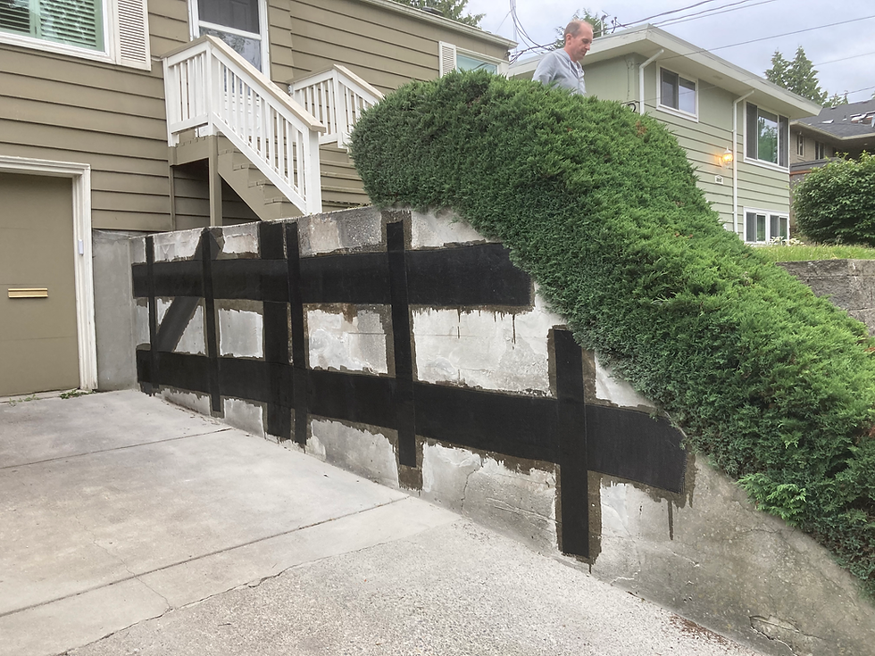 Carbon fiber structural repair products on a retaining wall