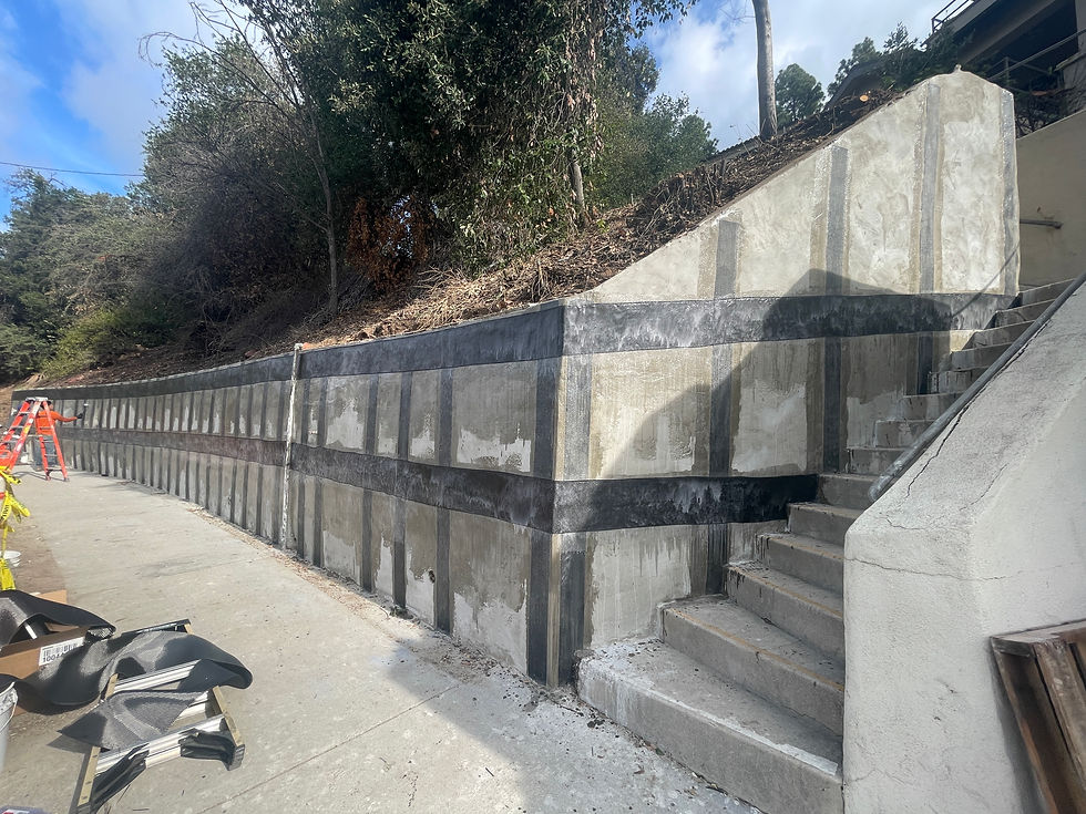 carbon fiber structural strengthening of a retaining wall in Los Angeles supporting a hillside. The repair utilizes structural reinforcement solutions SRS 600 Unidirectional carbon fiber to reinstate structural capacity and restore the walls safety