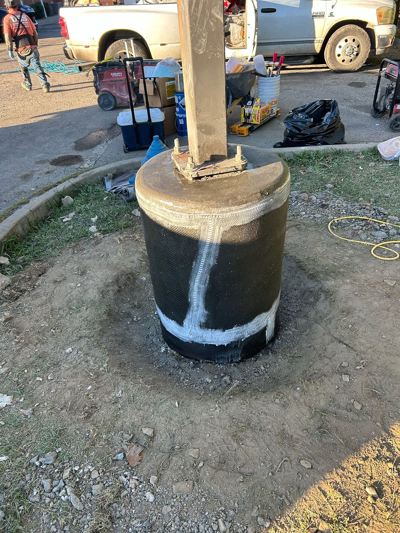 Edges seamed and concealed prior to UV coating on light pole foundation base