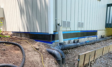 Foundation fully repaired with carbon fiber, showing reinforced areas to stabilize previously cracked and spalled sections
