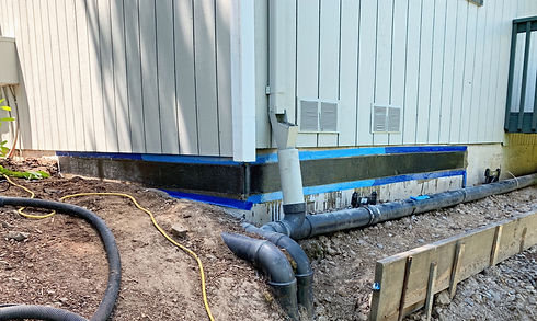 Foundation fully repaired with carbon fiber, showing reinforced areas to stabilize previously cracked and spalled sections