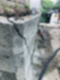 Image of a cracked concrete corner showing significant damage and in need of repair and reinforcement to restore integrity
