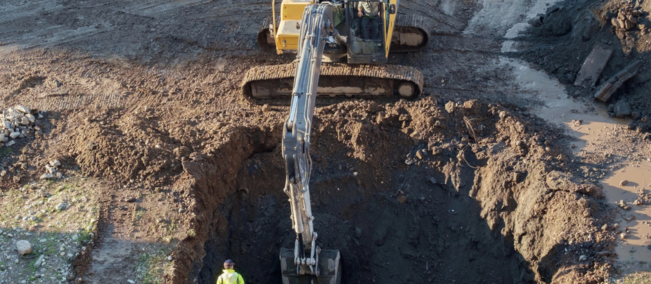 An engineer is in the field for a geotechnical assessment.