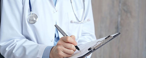 Healthcare professional doctor writing medical records on a clipboard