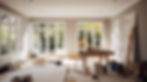 Sunlit room under renovation with large windows, scattered paint cans