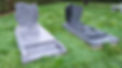 Tombstones grey black marble in the cemetery green grass