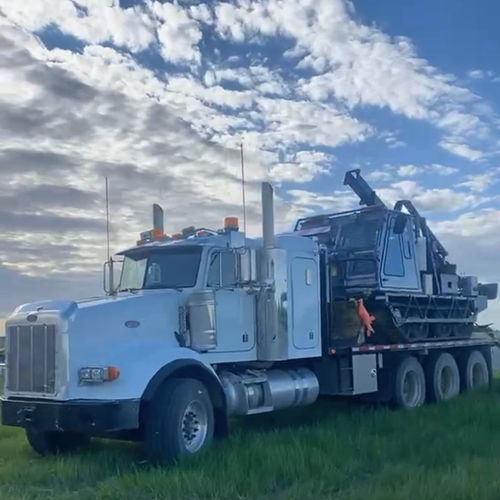 a white truck carrying coring unit