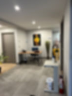 Reception area with desk and sunflower painting