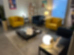 Waiting area with yellow and blue armchairs