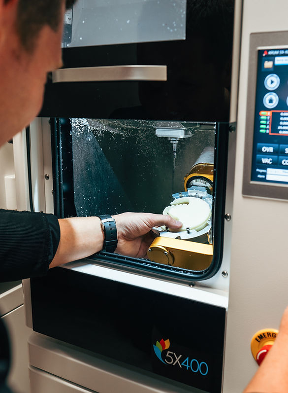 A man working on the making of digital dentures