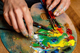 close-up-photo-of-woman-mixing-oil-paints-on-palette.jpg
