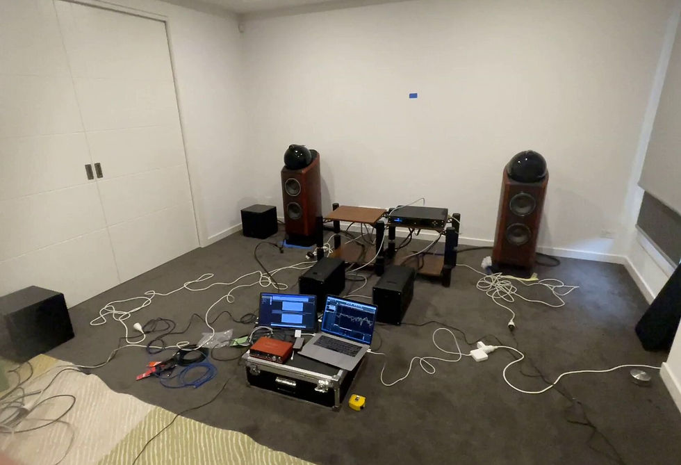 Adjusting subwoofer positions and measuring responses to identify the optimal configuration for balanced bass.