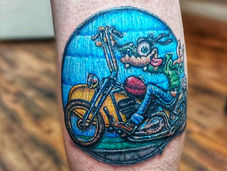 Embroidery Tattoo of Goofy in Bold Color. Placed on the calf done at Limitless Tattoo in Aldergrove