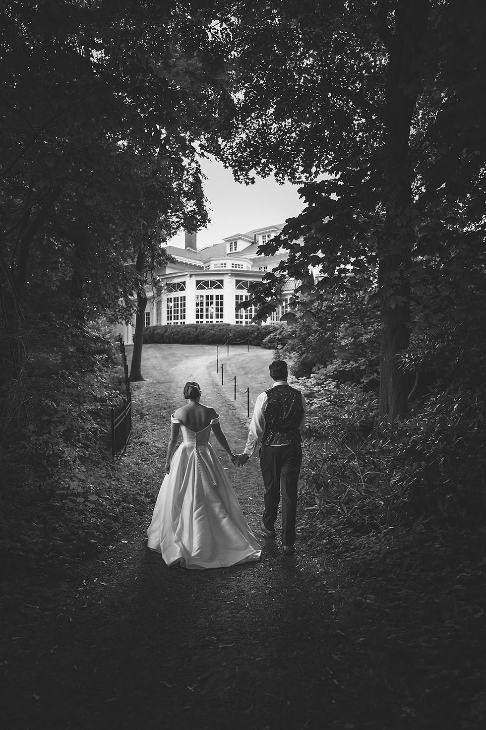 black and white wedding photo on beach path at Tupper Manor with conservatory