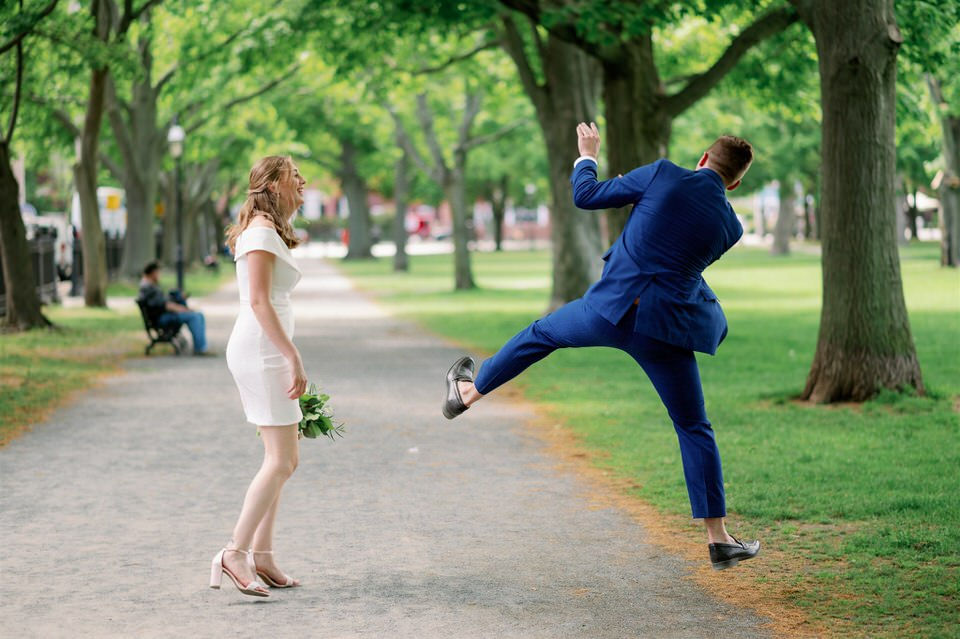 Groom jumping in Salem, Massachusetts City Elopement Portraits