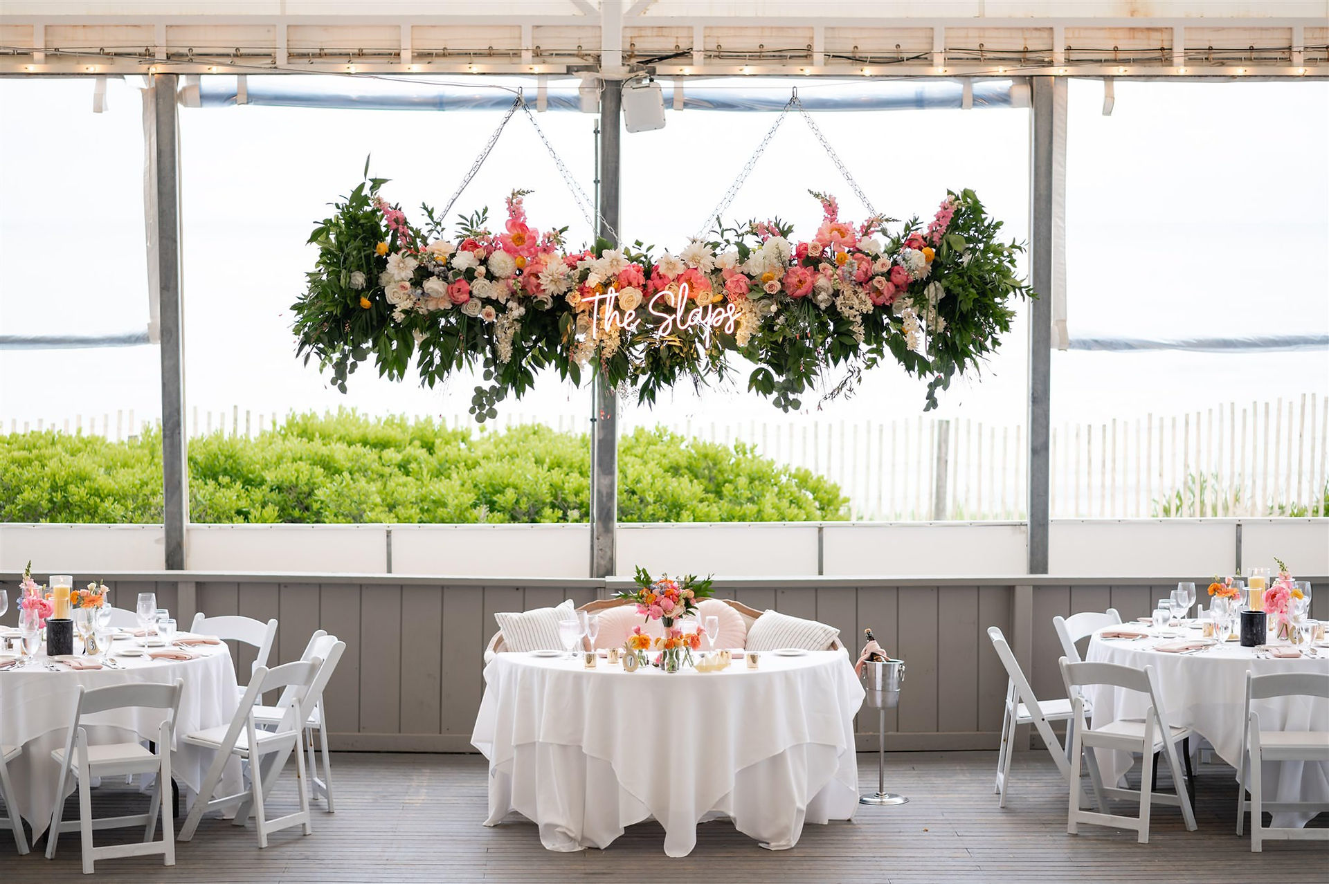 Popponesset Inn Tent Wedding reception with pink flowers