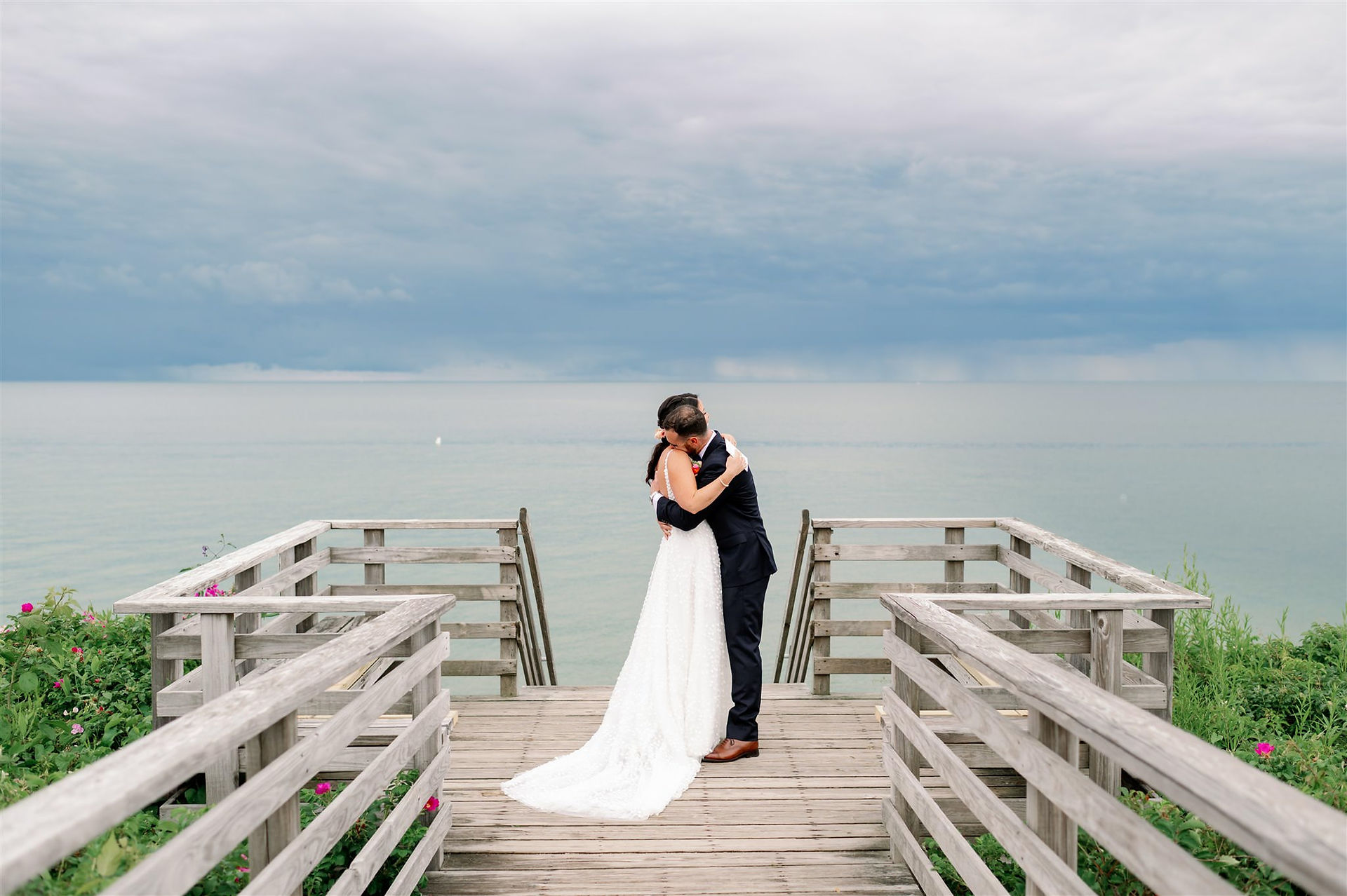 Bride and groom wedding portrait hugging at Cape Cod