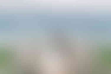 Bride and groom wedding portrait hugging at Cape Cod