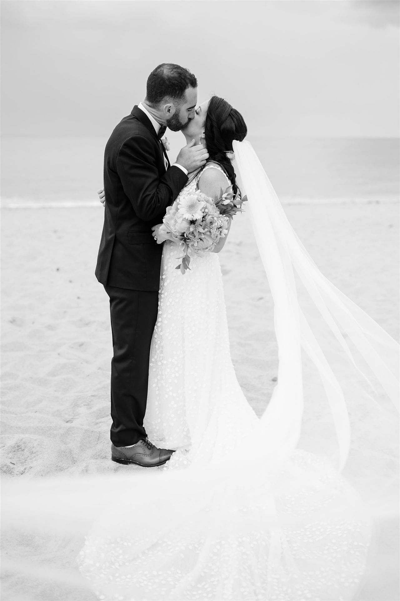 Bride and groom wedding portrait on the beach at Cape Cod