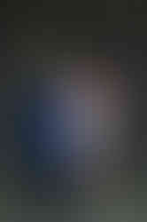 Bride and groom holding up rings hands