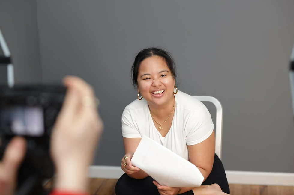 Actor smiling during an on-camera audition while holding a script